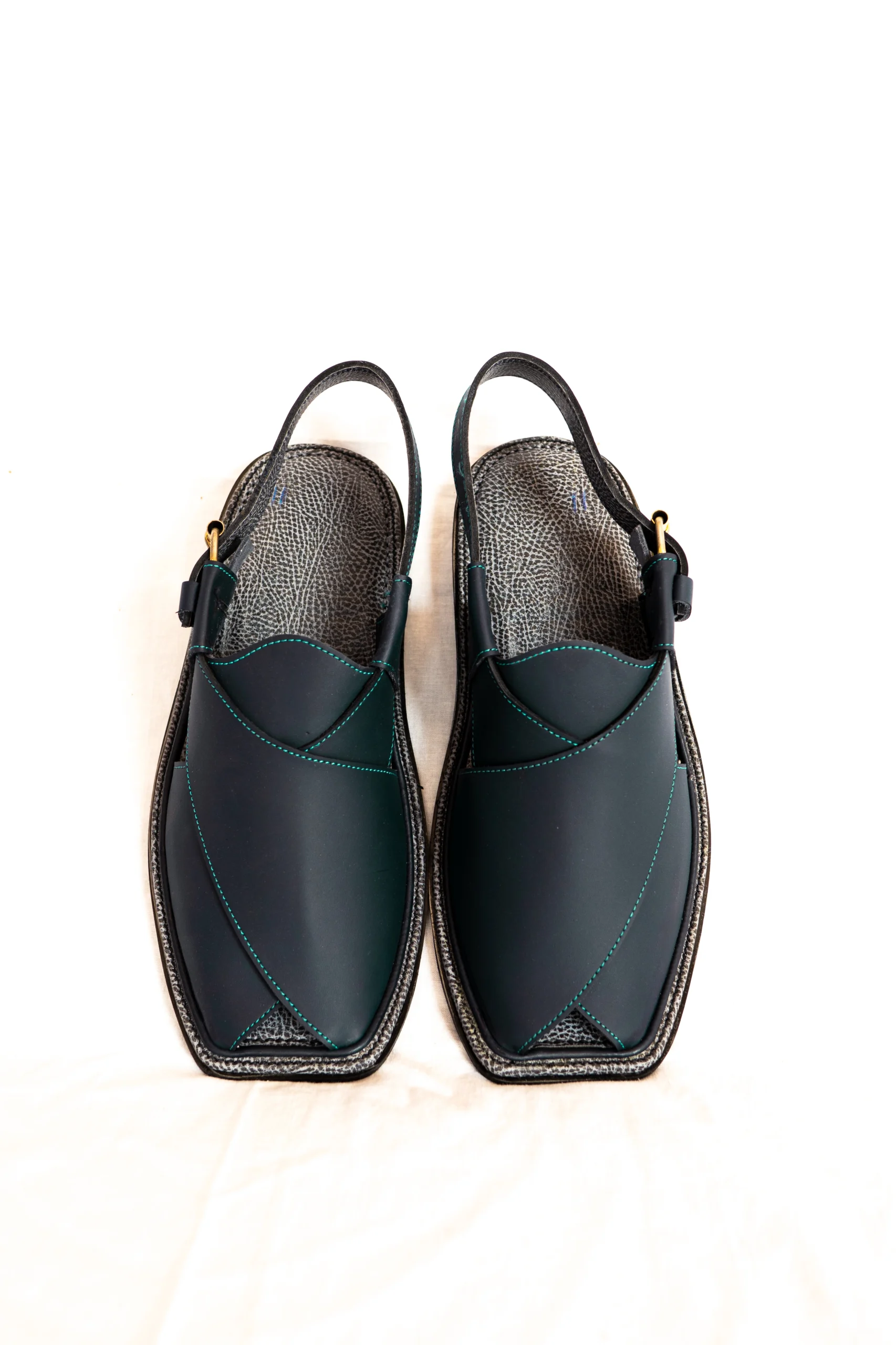 Black Zalmi chappal with teal stitching