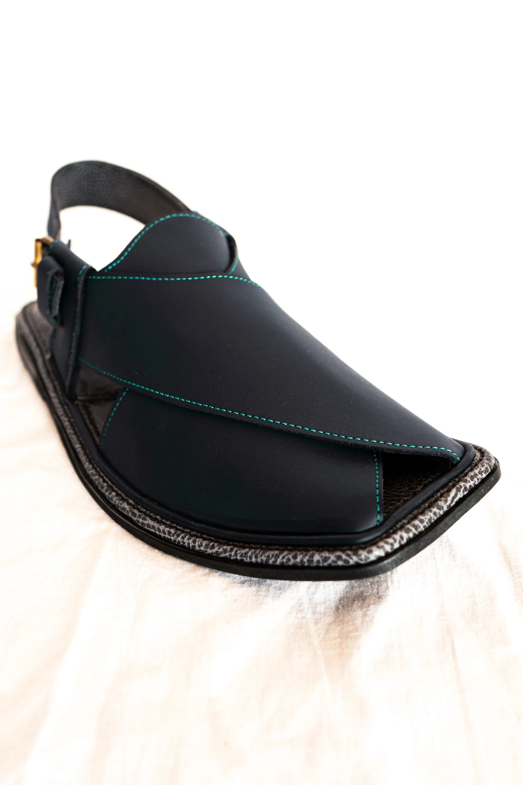 Black Zalmi chappal with teal stitching